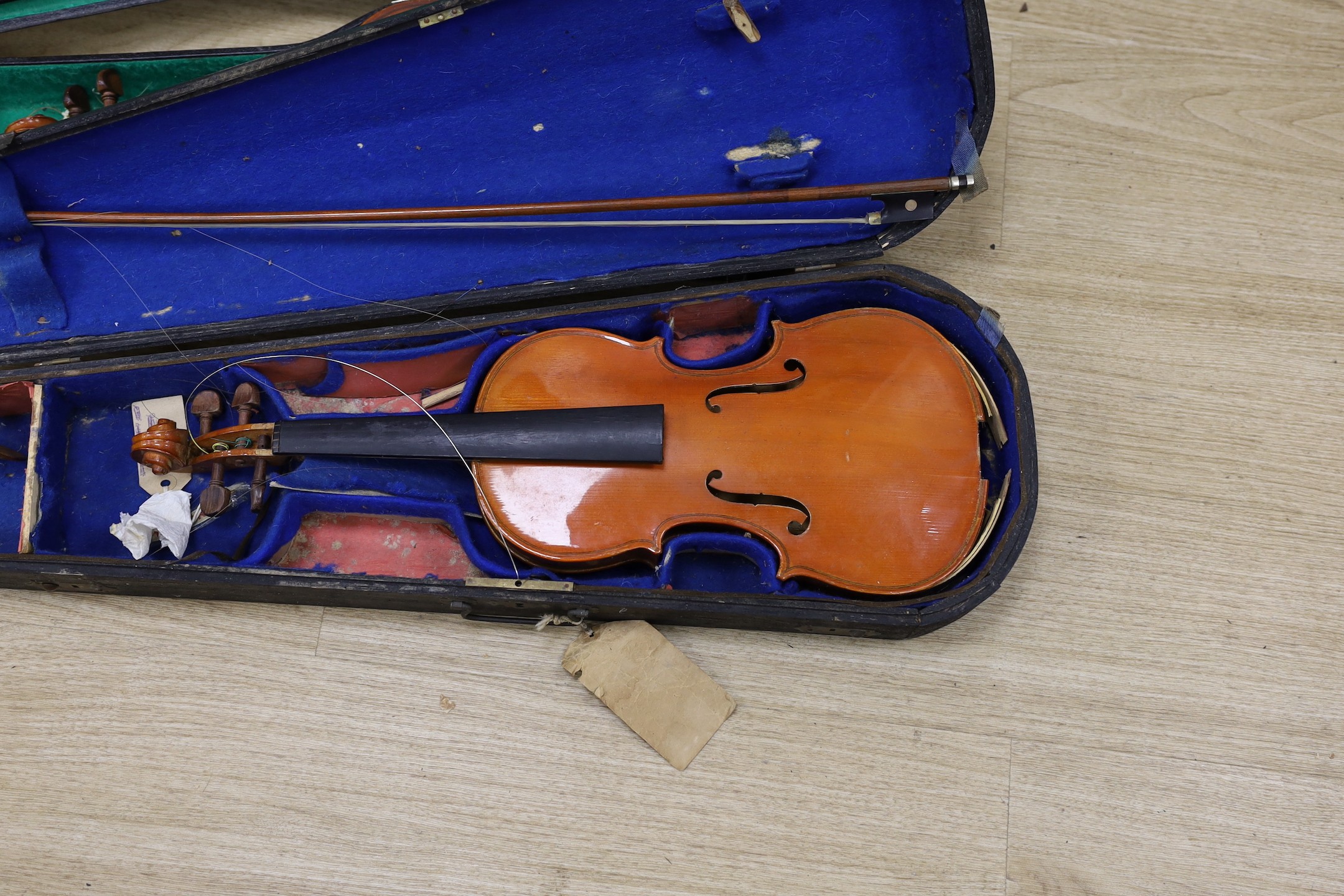 A double bass and three various violins, double bass 165cms high